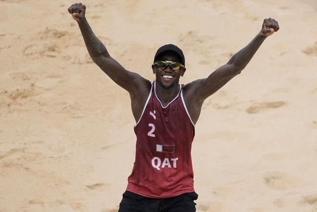 Ahmed Tijan, of Qatar, celebrates winning a men's beach volleyball Bronze Medal match against Latvia at the 2020 Summer Olympics, Saturday, Aug. 7, 2021, in Tokyo, Japan. (AP Photo/Petros Giannakouris)