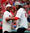 St. Louis Cardinals Hall-of-Famer Ozzie Smith, left, greets three-time Stanley Cup champion and St. Louis native Patrick Maroon after Maroon threw a ceremonial first pitch to him before a baseball game between the Cardinals and the Kansas City Royals, Friday, Aug. 6, 2021, in St. Louis. (AP Photo/Tom Gannam)