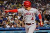 Los Angeles Angels' Jose Iglesias celebrates his solo home near the plate during the fifth inning of the team's baseball game against the Los Angeles Dodgers on Friday, Aug. 6, 2021, in Los Angeles. (AP Photo/Marcio Jose Sanchez)