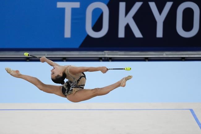 Linoy Ashram, of Israel, performs during the rhythmic gymnastics individual all-around qualifier at the 2020 Summer Olympics, Friday, Aug. 6, 2021, in Tokyo, Japan. (AP Photo/Ashley Landis)