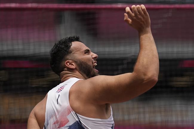 Taylor Campbell, of Britain, competes in qualifications for the men's hammer throw at the 2020 Summer Olympics, Monday, Aug. 2, 2021, in Tokyo. (AP Photo/David J. Phillip)