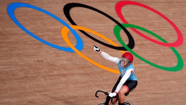 Kelsey Mitchell of Team Canada reacts to winning her heat during the track cycling women's sprint race at the 2020 Summer Olympics, Sunday, Aug. 8, 2021, in Izu, Japan. THE CANADIAN PRESS/AP-Christophe Ena