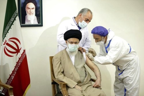 FILE - In this June 25, 2021 file photo, released by the official website of the Office of the Iranian Supreme Leader, Supreme Leader Ayatollah Ali Khamenei receives a shot of the Coviran Barekat COVID-19 vaccine in Tehran, Iran. On Sunday, Aug. 8, 2021, Iran reported more new infections and deaths across the country than on any other single day since the pandemic began. Khamenei, who has the final say on all state matters, last week ordered officials to discuss the possibility of a total national shutdown — something the government has been loath to enforce, fearing the damage it would do to an economy reeling from years of American sanctions. (Office of the Iranian Supreme Leader via AP, File)