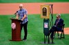 Former Philadelphia Phillies' Raul Ibanez, left, speaks to crowd as the Phillies retire Roy Halladay's number prior to a baseball game against the New York Mets, Sunday, Aug. 8, 2021, in Philadelphia. (AP Photo/Derik Hamilton)