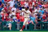 Philadelphia Phillies' Bryce Harper looks to the sky after hitting a solo home run off New York Mets starting pitcher Taijuan Walker during the sixth inning of a baseball game, Sunday, Aug. 8, 2021, in Philadelphia. (AP Photo/Derik Hamilton)