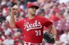 Cincinnati Reds starting pitcher Tyler Mahle (30) throws during the first inning of a baseball game against the Pittsburgh Pirates in Cincinnati, Sunday, Aug. 8, 2021. (AP Photo/Jeff Dean)