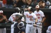 Baltimore Orioles' Cedric Mullins (31) is greeted by Austin Hays (21) after hitting a first-inning solo home run against Tampa Bay Rays starting pitcher Michael Wacha during a baseball game Sunday, Aug. 8, 2021, in Baltimore. (AP Photo/Terrance Williams)