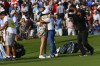 Abraham Ancer, center right, and girlfriend Nicole Curtrighthits hug on the 18th hole after Ancer won in a second playoff during the final round in the World Golf Championship-FedEx St. Jude Invitational tournament, Sunday, Aug. 8, 2021, in Memphis, Tenn. (AP Photo/John Amis)