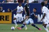 LA Galaxy midfielder Samuel Grandsir (11) and Vancouver Whitecaps midfielder Patrick Metcalfe (32) via for the ball in the first half of an MLS soccer match in Carson, Calif., Sunday, Aug. 8, 2021. (AP Photo/Ringo H.W. Chiu)