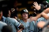 Chicago White Sox's Andrew Vaughn celebrates with teammates in the dugout after hitting a two-run home run during the first inning of a baseball game against the Chicago Cubs, Sunday, Aug 8, 2021, at Wrigley Field in Chicago. (AP Photo/Paul Beaty)