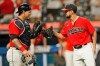 Cleveland Indians relief pitcher Nick Sandlin, right, is congratulated by catcher Wilson Ramos after they defeated the Cincinnati Reds in of a baseball game, Monday, Aug. 9, 2021, in Cleveland. (AP Photo/Tony Dejak)