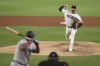 San Diego Padres starting pitcher Joe Musgrove delivers to Miami Marlins' Jesus Aguilar in the fifth inning of a baseball game Monday, Aug. 9, 2021, in San Diego. (AP Photo/Derrick Tuskan)