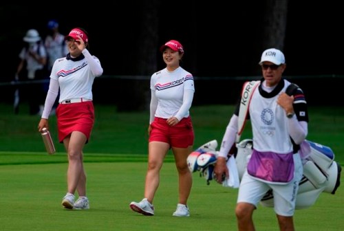 Jin Young Ko, of South Korea, left, and her teammate Sei Young Kim walk on the second fairway during the final round of the women's golf event at the 2020 Summer Olympics, Saturday, Aug. 7, 2021, at the Kasumigaseki Country Club in Kawagoe, Japan. (AP Photo/Andy Wong)