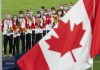 Members of the Canadian women’s soccer team watch the flag rise after being presented with their gold medals at the Tokyo Olympics in Tokyo, Japan on Friday August 6, 2021.&nbsp;The CBC is touting record-breaking digital audiences for the 2020 Tokyo Olympics, while television viewership ranked it the most-watched network in Canada throughout the Games. THE CANADIAN PRESS/ Frank Gunn