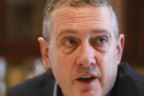 FILE - In this Nov. 19, 2019 file photo James Bullard, president of the St. Louis Federal Reserve Bank, speaks during an interview in Richmond, Va. Last week's jobs report demonstrated the ongoing strength of the U.S. economy and underscored the need for the Federal Reserve to rein in its stimulus efforts, a Fed official said Tuesday, Aug. 10, 2021  (AP Photo/Steve Helber)