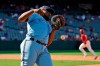 Toronto Blue Jays first baseman Vladimir Guerrero Jr. commits a fielding error allowing two runs to score on a fly ball from Los Angeles Angels' Jo Adell during the fifth inning in the first baseball game of a doubleheader Tuesday, Aug. 10, 2021, in Anaheim, Calif. (AP Photo/Marcio Jose Sanchez)