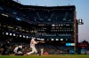 San Francisco Giants' Buster Posey (28) hits a home run in front of Arizona Diamondbacks catcher Carson Kelly during the fifth inning of a baseball game in San Francisco, Tuesday, Aug. 10, 2021. (AP Photo/Jeff Chiu)