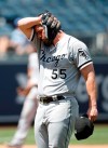 Chicago White Sox pitcher Carlos Rodon reacts to the heat during the fifth inning of a baseball game against the Kansas City Royals at Kauffman Stadium in Kansas City, Mo., Thursday, July 29, 2021. (AP Photo/Colin E. Braley)