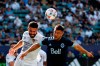 LA Galaxy defender Derrick Williams, left, and Vancouver Whitecaps forward Lucas Cavallini (9) vie for a head ball in first half MLS soccer action in Carson, Calif., Sunday, Aug. 8, 2021. The Vancouver Whitecaps say striker Lucas Cavallini will miss the next several weeks with a knee injury. THE CANADIAN PRESS/AP-Ringo H.W. Chiu