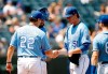 Kansas City Royals manager Mike Matheny (22) takes the ball from Kansas City Royals pitcher Brady Singer (51) as he is removed in the fourth inning of a baseball game against the New York Yankees at Kauffman Stadium in Kansas City, Mo., Wednesday, Aug. 11, 2021. (AP Photo/Colin E. Braley)