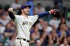 Milwaukee Brewers' John Curtiss reacts during the seventh inning of a baseball game against the Pittsburgh Pirates, Tuesday, Aug. 3, 2021, in Milwaukee. (AP Photo/Aaron Gash)