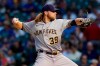 Milwaukee Brewers starting pitcher Corbin Burnes throws to a Chicago Cubs batter during the first inning of a baseball game in Chicago, Wednesday, Aug. 11, 2021. (AP Photo/Nam Y. Huh)