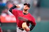 Arizona Diamondbacks starting pitcher Merrill Kelly (29) throws against the San Francisco Giants during the first inning of a baseball game Wednesday, Aug. 11, 2021, in San Francisco. (AP Photo/Tony Avelar)