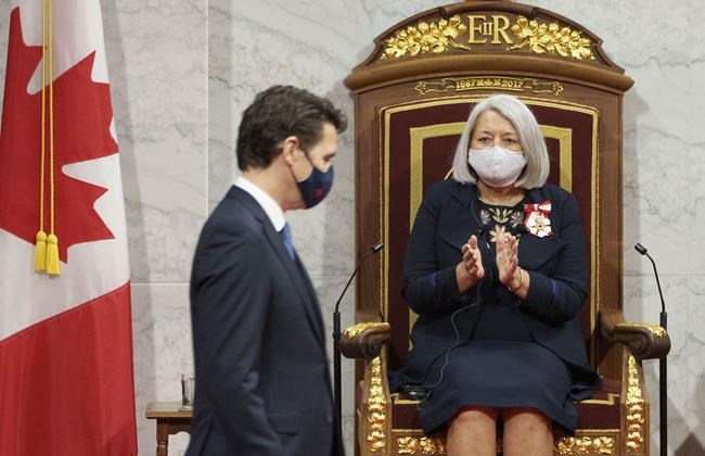 Governor General Mary Simon applauds Prime Minister Justin Trudeau following his speech during a ceremony in the Senate in Ottawa on Monday, July 26, 2021. THE CANADIAN PRESS/Paul Chiasson