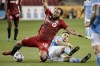 Toronto FC midfielder Nick DeLeon (18) is tackled by New York City midfielder Valentin Castellanos (11) during second half MLS soccer action in Toronto on August 7, 2021. THE CANADIAN PRESS/Chris Katsarov