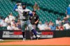 Texas Rangers third baseman Yonny Hernandez throws to first to get Seattle Mariners right fielder Mitch Haniger out on a ground out play during the first inning of a baseball game, Thursday, Aug. 12, 2021, in Seattle. (AP Photo/Ted S. Warren)