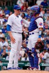 Chicago Cubs catcher Robinson Chirinos, right, talks with starting pitcher Kyle Hendricks after Milwaukee Brewers' Jace Peterson hit a two-run home run during the second inning of a baseball game in Chicago, Thursday, Aug. 12, 2021. (AP Photo/Nam Y. Huh)