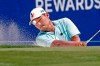 Sung Kang hits out of a trap on the 18th hole during the first round of the Wyndham Championship golf tournament at Sedgefield Country Club in Greensboro, N.C. on Thursday, Aug. 12, 2021. (AP Photo/Chris Seward)
