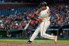 San Francisco Giants' LaMonte Wade Jr. hits a three-run home run against the Colorado Rockies during the fourth inning of a baseball game in San Francisco, Thursday, Aug. 12, 2021. (AP Photo/Jeff Chiu)