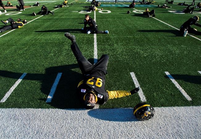 Hamilton Tiger-Cats defensive tackle Ted Laurent (97) stretches during practice ahead of the 107th Grey Cup in Calgary, Alta., Friday, Nov. 22, 2019. The Hamilton Tiger-Cats have returned injured Canadian veterans Ted Laurent and Chris Van Zeyl to their active roster. THE CANADIAN PRESS/Nathan Denette