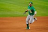 Oakland Athletics' Mitch Moreland sprints around the bags after hitting a triple off Texas Rangers relief pitcher Dennis Santana in the sixth inning of a baseball game in Arlington, Texas, Friday, Aug. 13, 2021. Yan Gomes scored on the hit. (AP Photo/Tony Gutierrez)