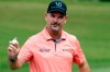 Rory Sabbatini waves to the crowd as he comes off the green on the second hole during the third round of the Wyndham Championship golf tournament at Sedgefield Country Club in Greensboro, N.C., Saturday, Aug. 14, 2021. (AP Photo/Chris Seward)