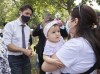 Prime Minister Justin Trudeau talks with a family following childcare funding announcement in Montreal on Thursday, August 5, 2021. THE CANADIAN PRESS/Graham Hughes