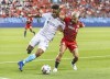 Toronto FC's Yeferson Soteldo, right, battles with New England Revolution's Brandon Bye during the first half of MLS soccer action in Toronto, Saturday August 14, 2021.  THE CANADIAN PRESS/Mark Blinch