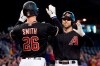 Arizona Diamondbacks' Drew Ellis, right, celebrates his three run home run against the San Diego Padres with teammate Pavin Smith (26) during the first inning of a baseball game, Saturday, Aug. 14, 2021, in Phoenix. (AP Photo/Matt York)
