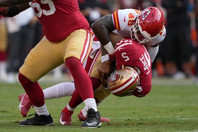 San Francisco 49ers quarterback Trey Lance (5) is sacked by Kansas City Chiefs linebacker Omari Cobb (48) during the first half of an NFL preseason football game in Santa Clara, Calif., Saturday, Aug. 14, 2021. (AP Photo/Tony Avelar)