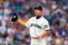 Seattle Mariners starting pitcher Yusei Kikuchi gets a new ball after giving up a solo home run to Toronto Blue Jays' Teoscar Hernandez during the second inning of a baseball game Saturday, Aug. 14, 2021, in Seattle. (AP Photo/Elaine Thompson)