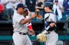 New York Yankees relief pitcher Wandy Peralta, left, celebrates with catcher Kyle Higashioka after they defeated the Chicago White Sox in a baseball game in Chicago, Sunday, Aug. 15, 2021. (AP Photo/Nam Y. Huh)