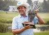 Doug Barron, right, of the United States, holds the trophy after winning the PGA Tour Champion's Shaw Charity Classic golf event in Calgary, Alta., Sunday, Aug. 15, 2021.THE CANADIAN PRESS/Jeff McIntosh