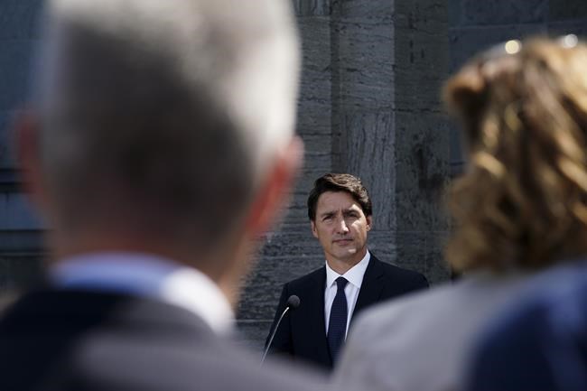 Reporters as questions as Prime Minister Justin Trudeau holds a press conference after meeting with Governor General Mary Simon and triggering an election at Rideau Hall in Ottawa on Sunday, Aug 15, 2021. THE CANADIAN PRESS/Sean Kilpatrick