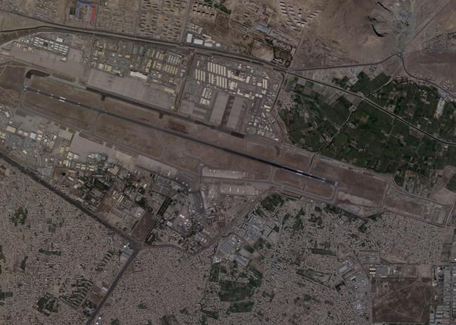 This satellite photo from Planet Labs Inc. shows Kabul International Airport, also known as Hamid Karzai International Airport, Monday Aug. 16, 2021. Afghans rushed onto the tarmac of the capital's airport on Monday as thousands tried to flee the country after the Taliban seized power with stunning speed. Some clung to the side of a U.S. military transport plane before takeoff, in a widely shared video that captured the sense of desperation as America's 20-year war comes to a chaotic end. (Planet Labs Inc. via AP)