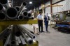 Liberal Leader Justin Trudeau and Liberal candidate for the riding of Longueuil-Saint-Hubert, Florence Gagnon, are given a tour of ETI Converting Equipment's facility by ETI President Maxime Bayzelon in Longueuil, Que., on Monday, Aug. 16, 2021. ETI's website says they are a globally innovative manufacturer of in-line coating and printing equipment dedicated to the label printing industry. THE CANADIAN PRESS/Sean Kilpatrick