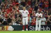 Cincinnati Reds' Joey Votto (19) acknowledges the crowd after hitting a single during the seventh inning of a baseball game against the Chicago Cubs in Cincinnati, Monday, Aug. 16, 2021. The hit was the 2,000th of his career. (AP Photo/Aaron Doster)