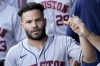 Houston Astros' Jose Altuve celebrates in the dugout after scoring on a single by Yordan Alvarez during the first inning of a baseball game against the Kansas City Royals Monday, Aug. 16, 2021, in Kansas City, Mo. (AP Photo/Charlie Riedel)