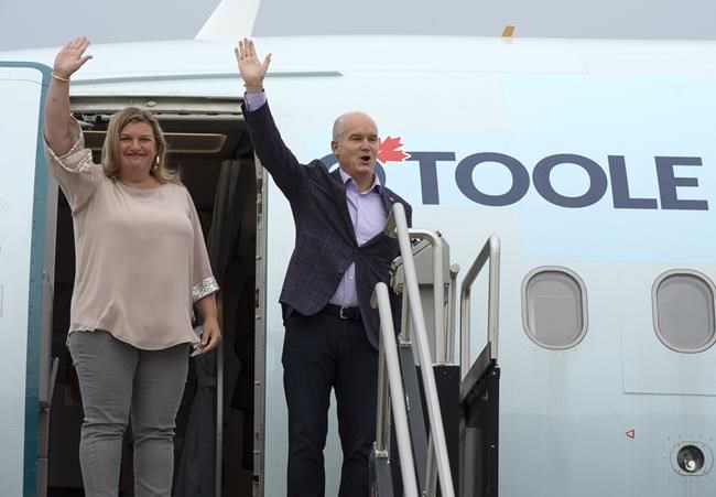 Conservative Leader Erin O'Toole and his wife Rebecca board the campaign plane Tuesday, August 17, 2021 in Ottawa. Canadians will vote in a federal election Sept. 20th.THE CANADIAN PRESS/Ryan Remiorz