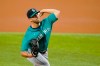 Seattle Mariners starting pitcher Tyler Anderson throws to a Texas Rangers batter during the first inning of a baseball game in Arlington, Texas, Tuesday, Aug. 17, 2021. (AP Photo/Tony Gutierrez)